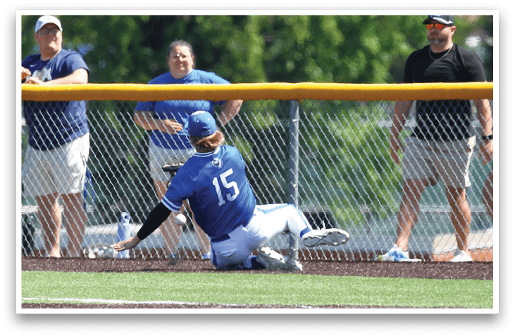 A baseball player slides into home plate. Description generated by AI
