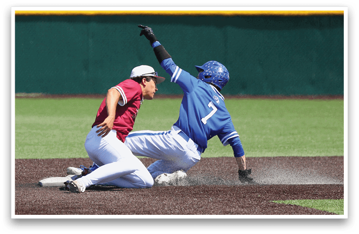 A baseball player slides into a base. Description generated by AI