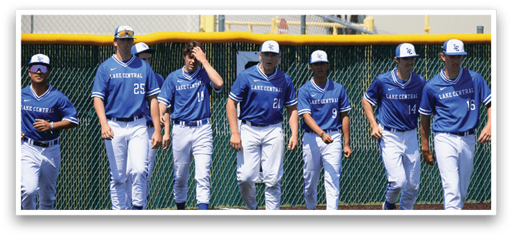 A group of baseball players wearing blue uniforms. Description generated by AI