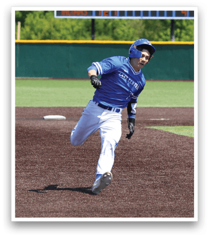 A baseball player running on the field. Description generated by AI