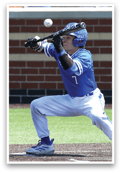 A baseball player is in the process of swinging his bat at a ball. Description generated by AI