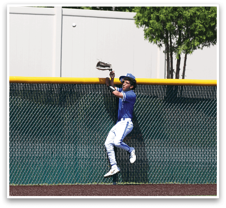 A baseball player catching a ball. Description generated by AI