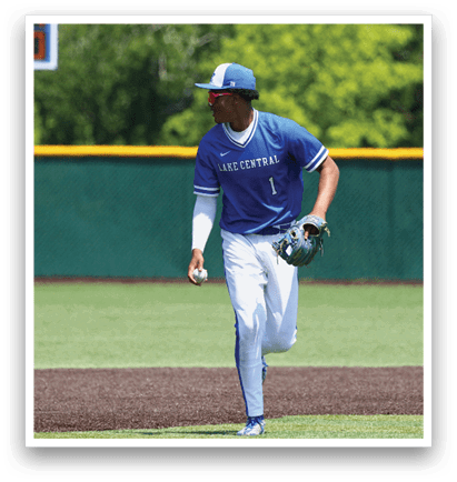 A baseball player wearing a blue and white uniform. Description generated by AI