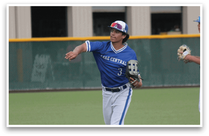 A baseball player catching a ball. Description generated by AI