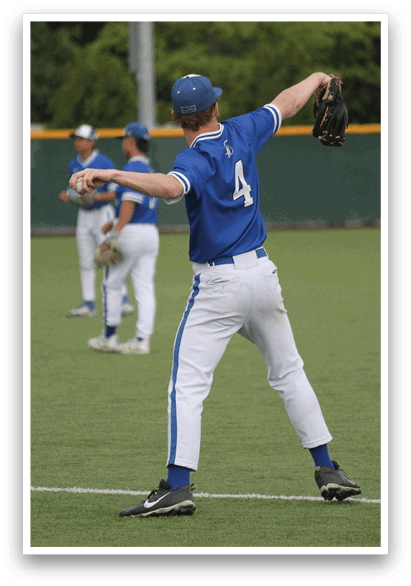 A baseball player in a blue uniform is throwing a ball. Description generated by AI