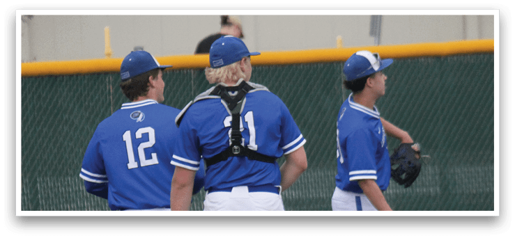 Three baseball players wearing blue uniforms. Description generated by AI