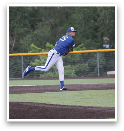 A baseball player in a blue and white uniform is throwing a ball. Description generated by AI