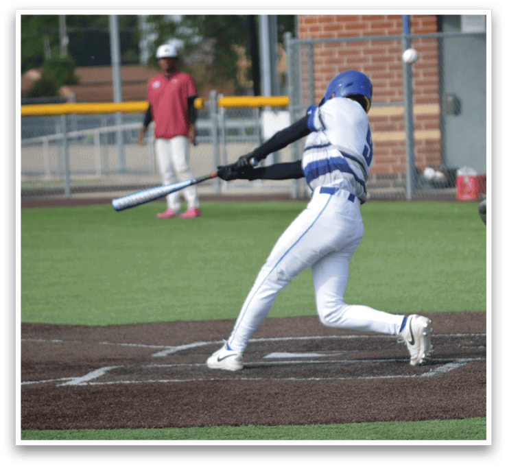 A baseball player is swinging a bat at a ball. Description generated by AI