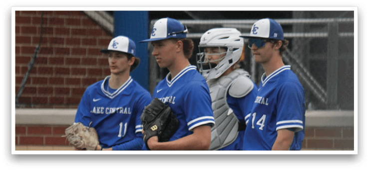 A group of baseball players standing on the field. Description generated by AI