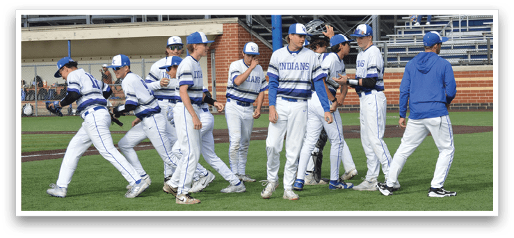 Baseball players wearing blue and white uniforms. Description generated by AI