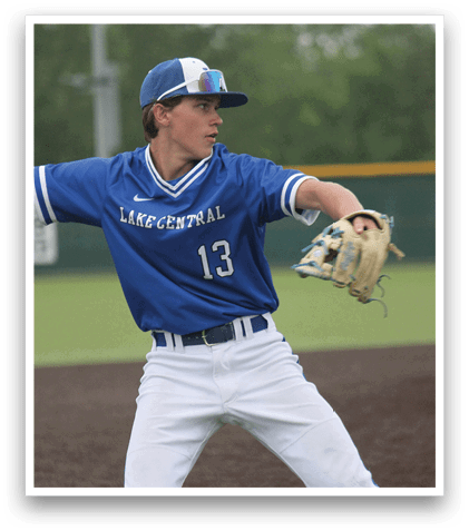 A baseball player wearing a blue shirt and white pants. Description generated by AI