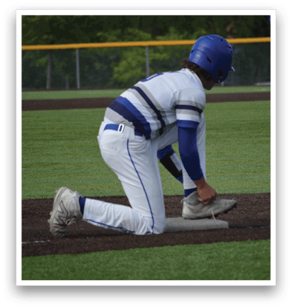 A baseball player bends over to pick up a baseball. Description generated by AI