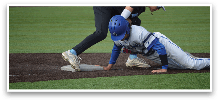 A baseball player slides into a base. Description generated by AI
