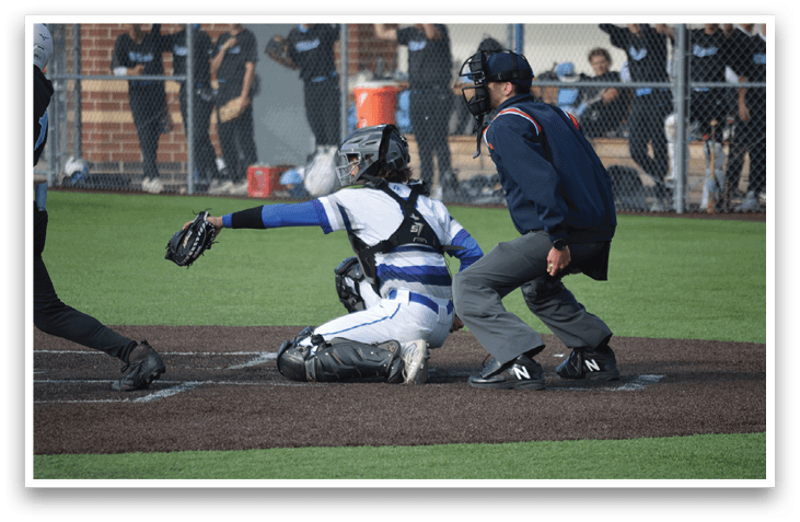 A baseball player is sliding into home plate. Description generated by AI