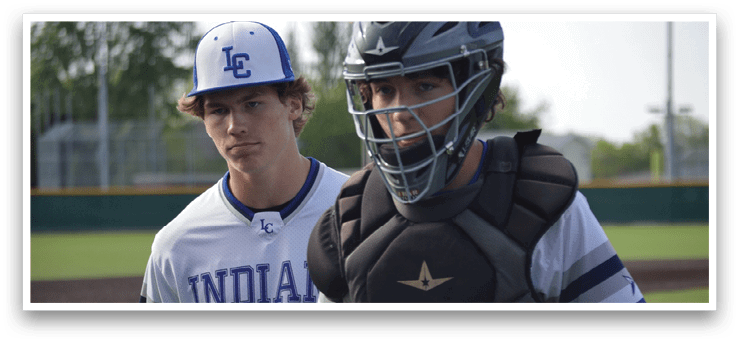 A baseball player wearing a blue and white uniform. Description generated by AI