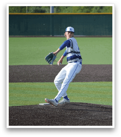 A baseball player in a blue and white uniform is pitching a ball. Description generated by AI