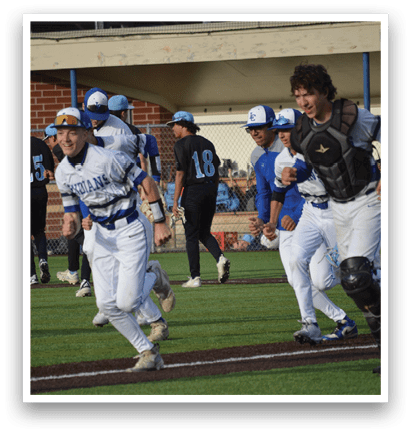 A baseball player running to the base. Description generated by AI