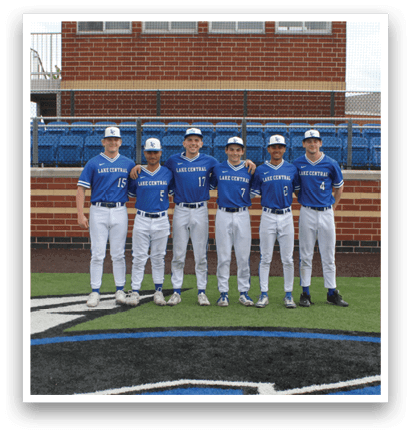A group of five baseball players standing on a field. Description generated by AI
