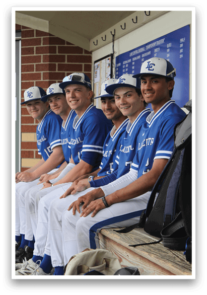A group of baseball players sitting on a bench. Description generated by AI