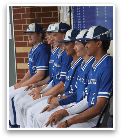 Baseball players sitting on bench. Description generated by AI