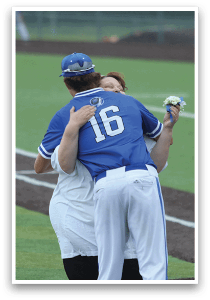 Two baseball players hugging each other. Description generated by AI