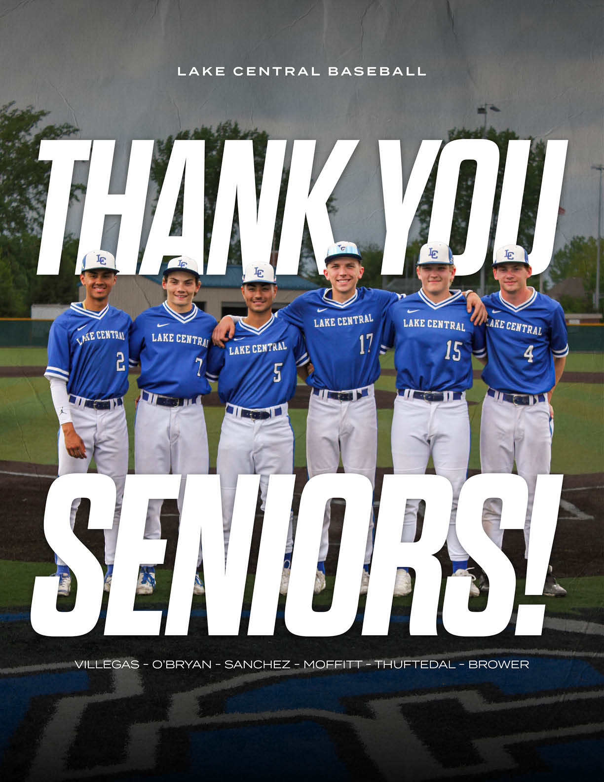 A group of baseball players in blue uniforms. Description generated by AI