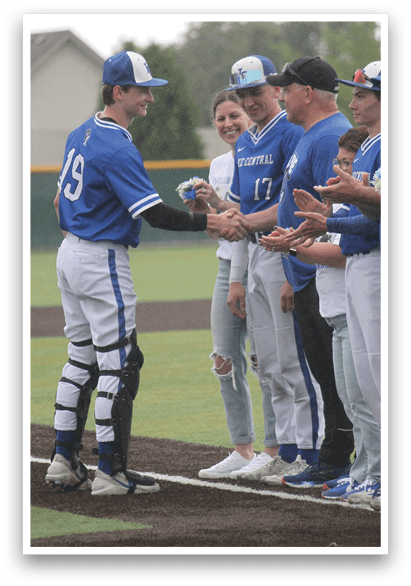A group of baseball players shaking hands. Description generated by AI
