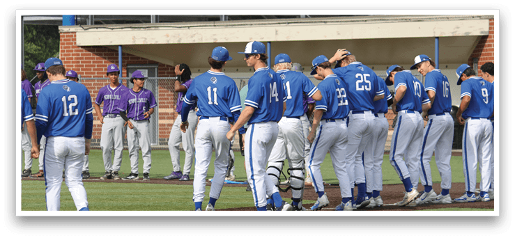 Baseball players wearing blue uniforms. Description generated by AI