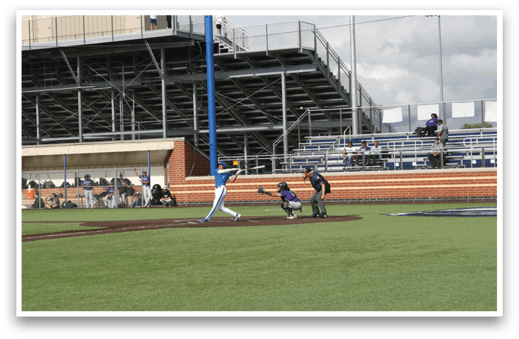 A baseball game is being played in a stadium. Description generated by AI