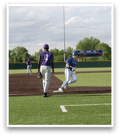 A baseball game is taking place with a group of people playing. Description generated by AI