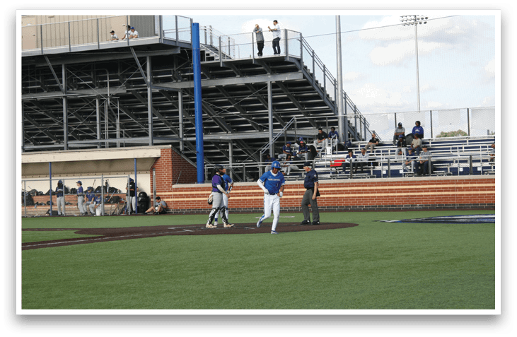 A baseball game is taking place in a stadium. Description generated by AI