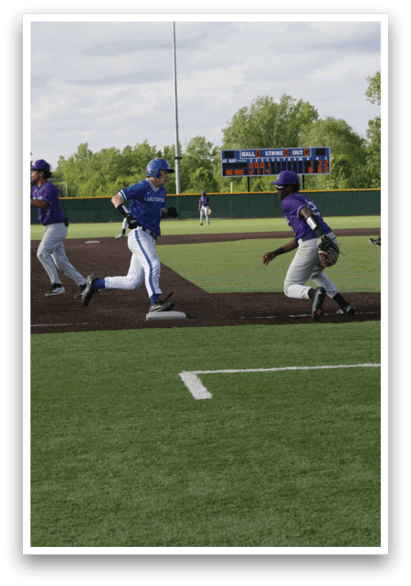 A baseball game is taking place on a field. Description generated by AI