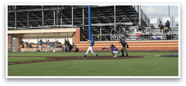 A baseball game is being played on a field. Description generated by AI