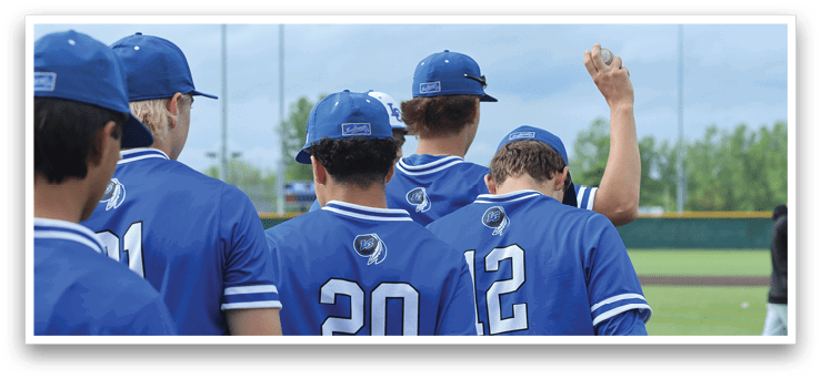 A group of baseball players wearing blue uniforms. Description generated by AI