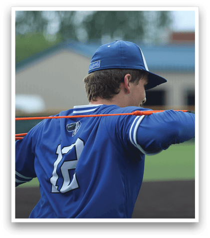 A baseball player wearing a blue and white uniform. Description generated by AI