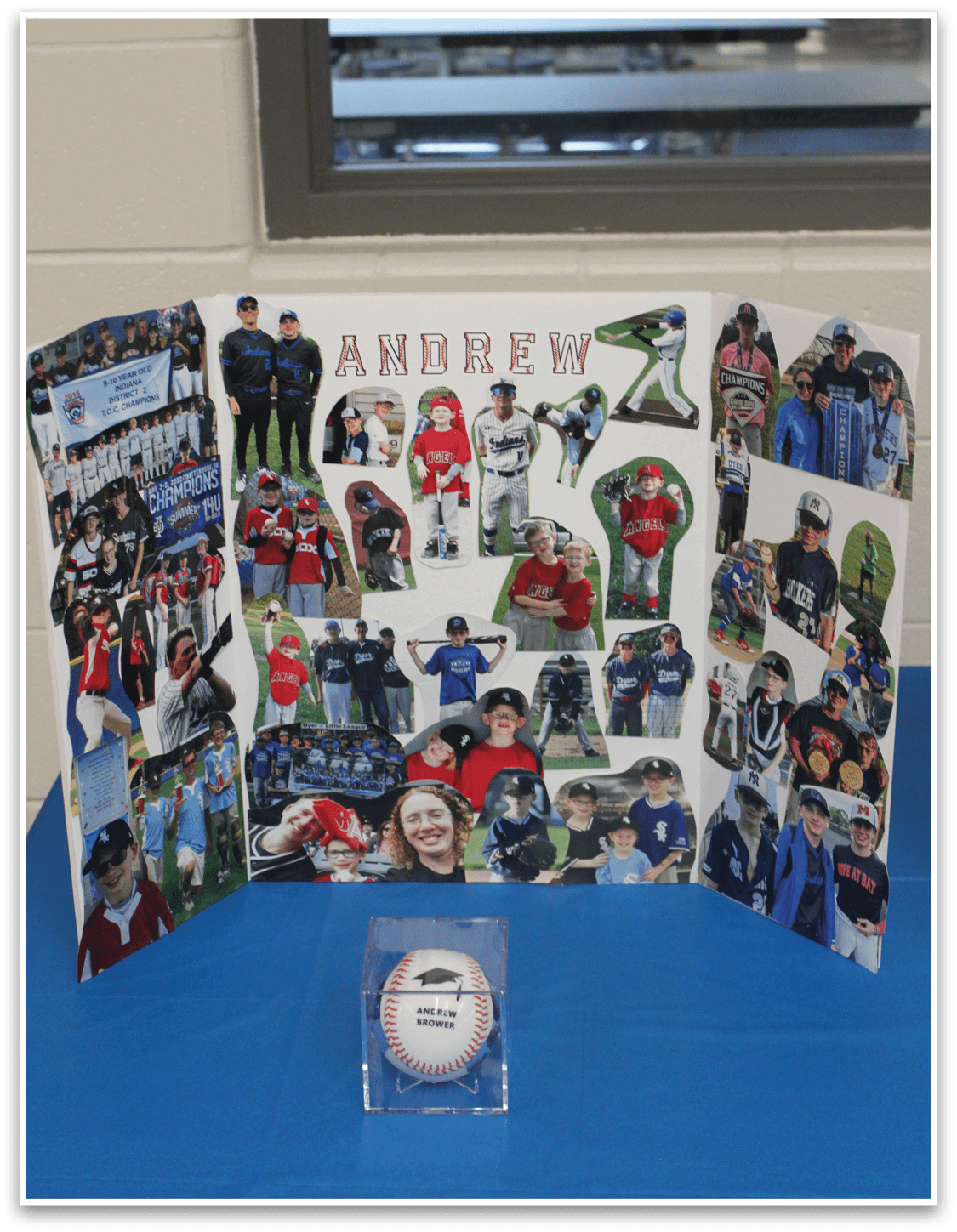 A display of photos and a baseball. Description generated by AI
