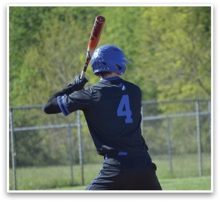 A baseball player in a black shirt and blue number 4. Description generated by AI