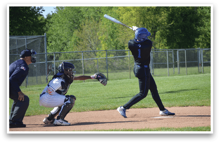 A baseball player is swinging a bat at a ball. Description generated by AI