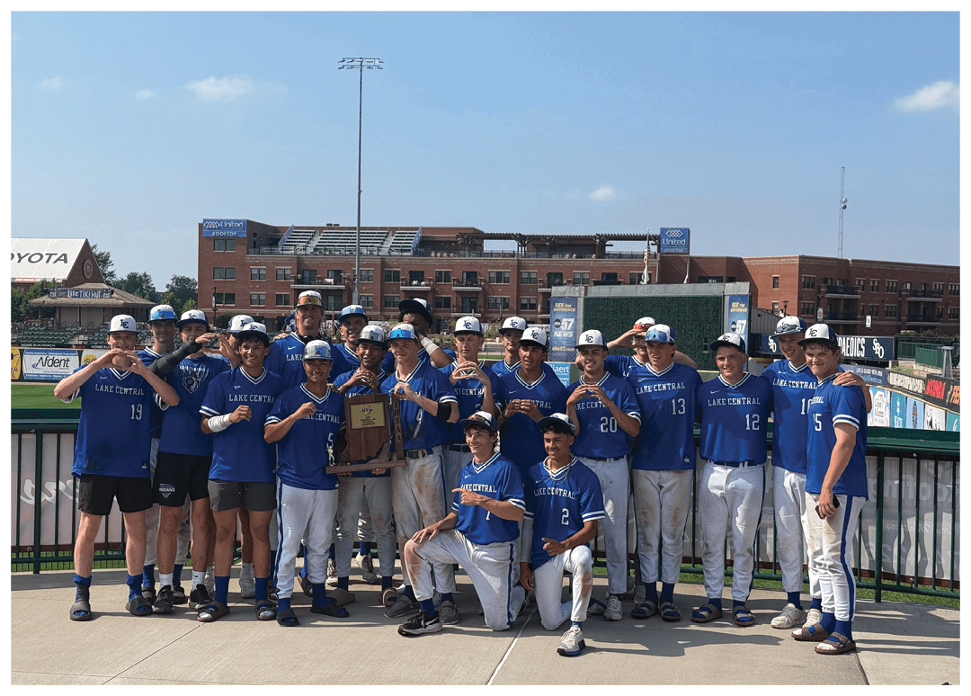 A group of baseball players posing for a picture. Description generated by AI