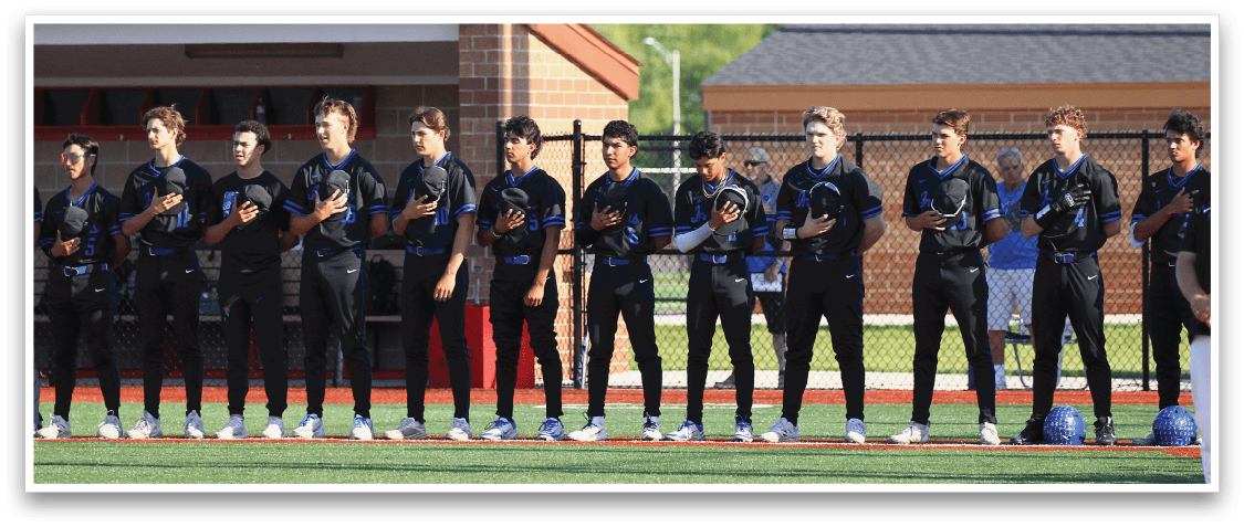 Baseball players standing on a field. Description generated by AI