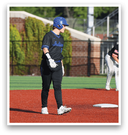 A baseball player wearing a blue helmet. Description generated by AI