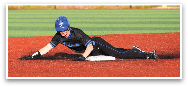 A baseball player sliding into a base. Description generated by AI