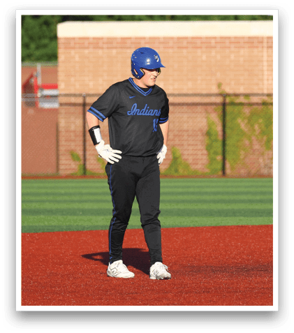 A baseball player wearing a blue helmet and black jersey. Description generated by AI