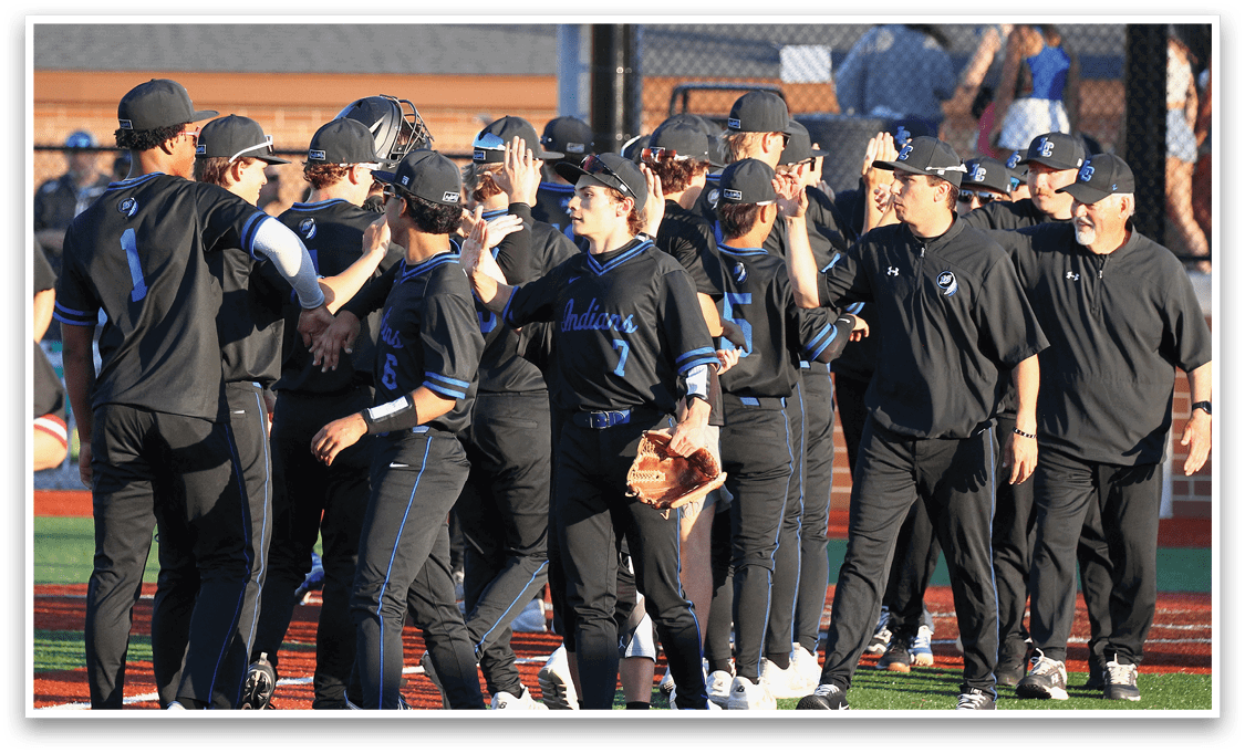 A group of baseball players wearing black shirts and blue pants. Description generated by AI