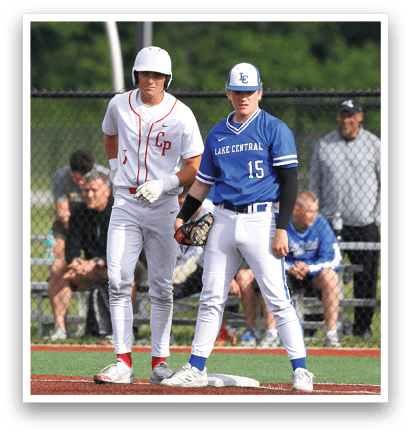 Two baseball players standing on a field. Description generated by AI