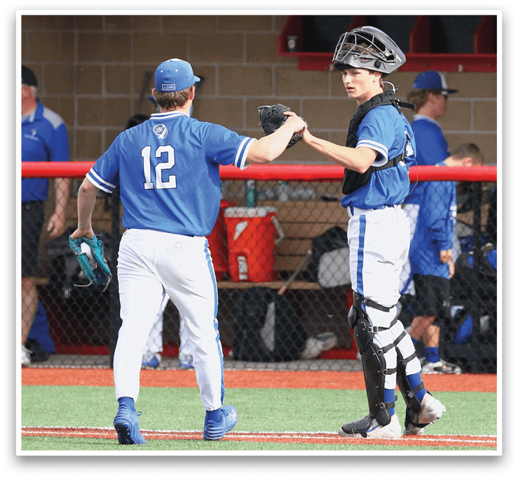 Two baseball players shake hands. Description generated by AI
