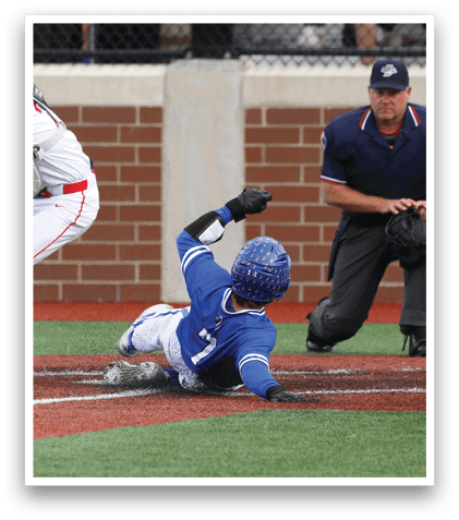 A baseball player slides into home plate. Description generated by AI