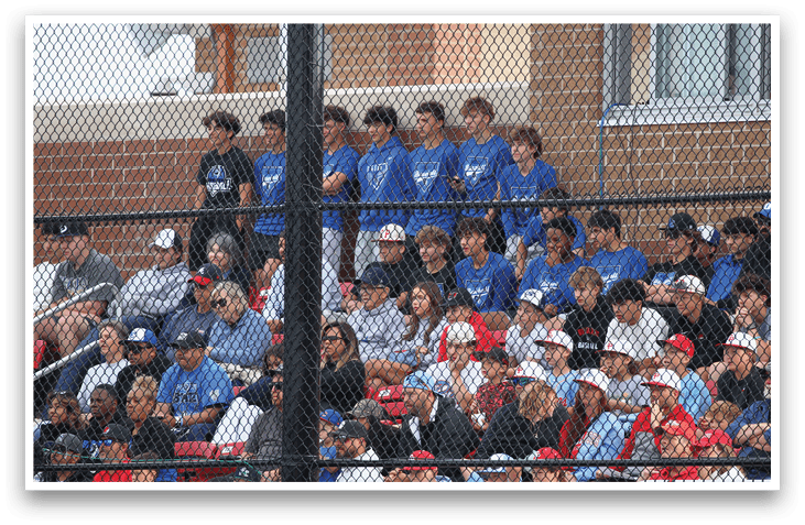 A group of people are sitting in the stands at a baseball game. Description generated by AI