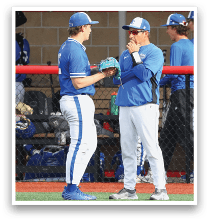 A baseball player wearing a blue hat and blue shirt. Description generated by AI