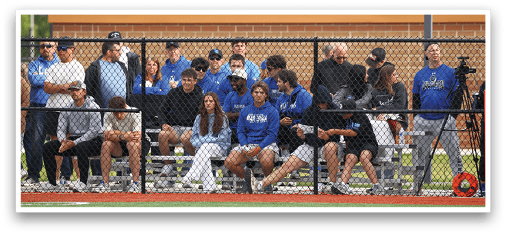 A group of people are sitting on a bench. Description generated by AI